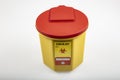 Medical waste bin 1,3 liter. Yellow biohazard medical contaminated clinical waste container isolated on white background Royalty Free Stock Photo
