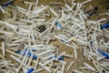 Medical waste. A pile of used discarded disposable plastic syringes Royalty Free Stock Photo