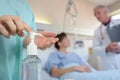 Medical worker applying hand sanitizer