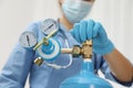 Medical worker checking oxygen tank in hospital room, closeup Royalty Free Stock Photo