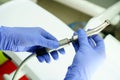 A medical worker connects a disassembled boron machine for dental treatment, preparation for treatment, repair of a medical