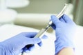 A medical worker connects a disassembled boron machine for dental treatment, preparation for treatment, repair of a medical