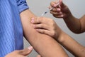 Medical worker injecting insulin dose to the patient