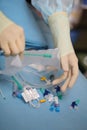 Medical worker opened the pack of catheterization tools during p Royalty Free Stock Photo
