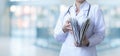 A medical worker opens a folder with case histories