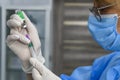 Medical worker removes a dose of AstraZeneca Covishield vaccine from a vial at a hospital in Kyiv, Ukraine