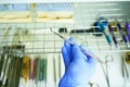 A medical worker puts a medical instrument in a device for disinfection and cleaning of germs. Stylishness and cleanliness in