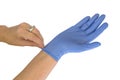 Medical worker putting blue glove isolated on white background