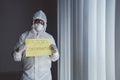Medical worker showing Stop Coronavirus text