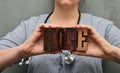 A medical worker with a stethoscope holds the word `hope` made of wooden typographic letters