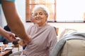 Medical worker taking care of woman in geriatric hospice Royalty Free Stock Photo