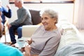 Medical worker taking care of elderly woman in hospice Royalty Free Stock Photo