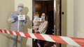 Medical worker visiting family of mother and daughter at home during coronavirus quarantine lockdown