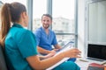 Medical workers having a changeover and looking positive Royalty Free Stock Photo