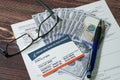 Medicare card, application form and cash with eyeglasses and pen. Royalty Free Stock Photo