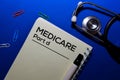 Medicare Part d write on book isolated on wooden table. Medical or Finance concept Royalty Free Stock Photo