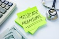 Medicare premiums written on the sticker and stethoscope. Royalty Free Stock Photo