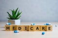 MEDICARE word made with building blocks, medical concept background