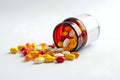 Medication bottles with a mix of red and yellow pills and capsules for health vitamins, capsules by Generative AI