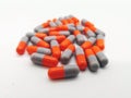 Medication and healthcare concept. Many gray-orange capsules of Royalty Free Stock Photo