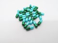 Medication and healthcare concept. Many green-blue capsules of A Royalty Free Stock Photo