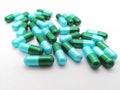 Medication and healthcare concept. Many green-blue capsules of A Royalty Free Stock Photo