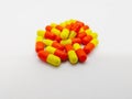 Medication and healthcare concept. Many orange-yellow capsules o