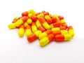 Medication and healthcare concept. Many orange-yellow capsules o