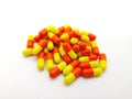 Medication and healthcare concept. Many orange-yellow capsules o