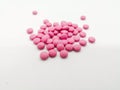 Medication and healthcare concept. Many round pink tablets of As