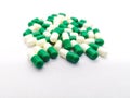 Medication and healthcare concept. Many white-green capsules of Royalty Free Stock Photo