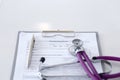 Medication history record form lying on table with stethoscope and silver pen. Medicine or pharmacy concept. Medical Royalty Free Stock Photo