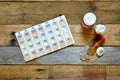 Medications, pillbox and bottles with coins spilling out. Royalty Free Stock Photo