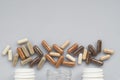 Medicinal capsule spill out of a three plastic bottles on a ligh Royalty Free Stock Photo