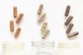 Medicinal capsule spill out of a three plastic bottles Royalty Free Stock Photo