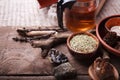 Medicinal herbs, homeopathy, dried flowers, stones and glass teapot - alternative medicine, relax concept, wooden background, copy