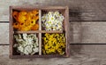 Medicinal herbs tansy daisy calendula yarrow in an old wooden box on the table Royalty Free Stock Photo