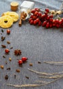 Medicinal plants and herbs composition Bunch of rose hips branch rose rose on blue Royalty Free Stock Photo