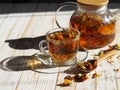 Medicinal tea made from dried flowers of calendula and marigolds on a wooden table. The use of herbal tea in alternative medicine Royalty Free Stock Photo