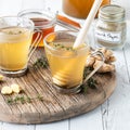 Medicinal tea using ginger, thyme and honey, ready for drinking. Royalty Free Stock Photo