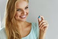 Medicine. Beautiful Smiling Woman Taking Medication Pill Royalty Free Stock Photo