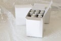 Medicine bottles in white paper box and air bubble Royalty Free Stock Photo