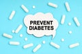On a blue background pills and a plate. Inside the sign it says - PREVENT DIABETES