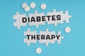 On a blue background pills and puzzles with the inscription - DIABETES THERAPY