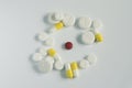 Medicine concept .red pill in circle of other white and yellow pills Royalty Free Stock Photo