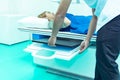 Medicine concept ,Technician Doctor male radiologist with colleague setting up machine to take female patient in x-ray room Royalty Free Stock Photo