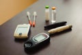 medicine, diabetes and health care concept - close up of blood sugar test stripe, glucometer, insulin pen and other Royalty Free Stock Photo