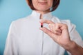 Medicine doctor holding a color capsule pill in hand Royalty Free Stock Photo