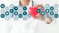 Medicine doctor holding red heart shape in hand with icon medical Royalty Free Stock Photo