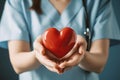 Medicine doctor holding red heart shape in hand, Medical heart cardiology concept Royalty Free Stock Photo